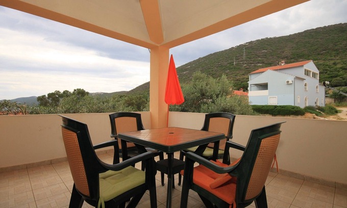 Mali Losinj Apartment | One bedroom apartment with terrace and sea view Sveti Jakov, Lošinj (A-8011-a)
