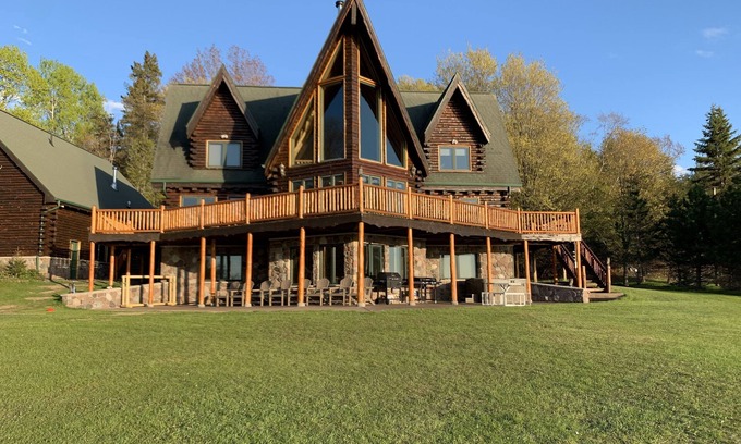 Skanee Cabin | One of a kind family retreat: lake front access, hot tub, sauna, and game room.