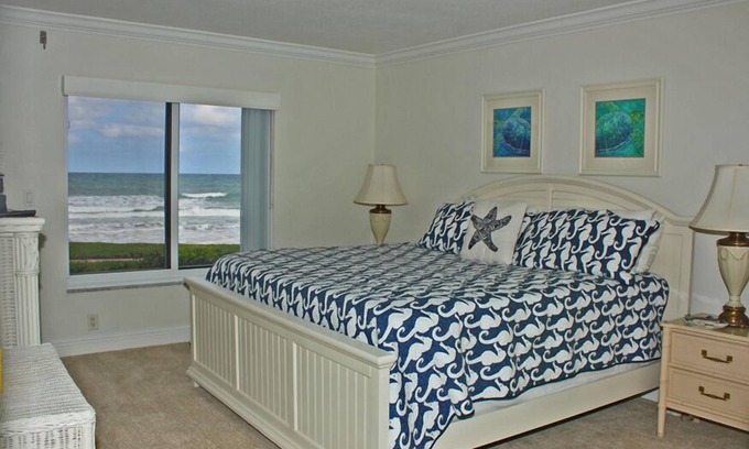 New Smyrna Beach Condo | One of a kind ground floor, three bedroom, three bath corner. Amazing south east ocean views.