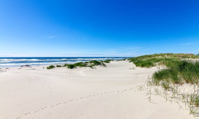 Bayshore House | Out The Door And Onto Sand! Dog Friendly! Hot Tub! Game Room!
