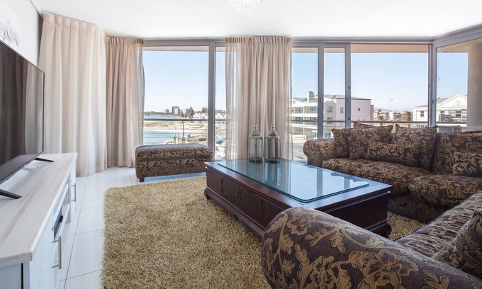 Lagoon Beach Apartment | Panoramic Views with Balcony, Beach and Bar Access