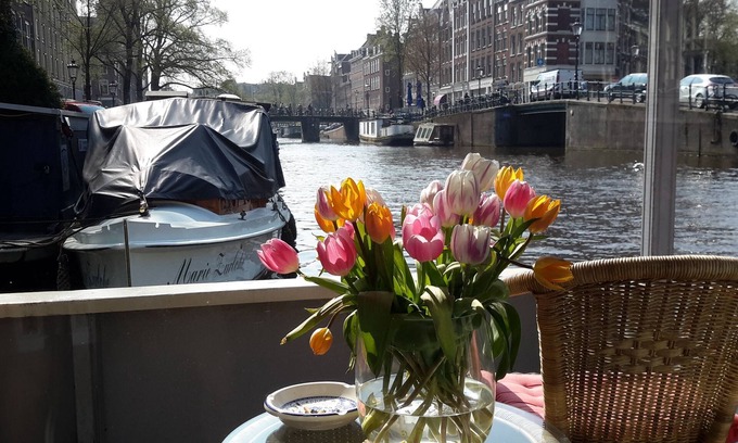 Grachtengordel-West Boat Rental | Pantheos Houseboat in Prinsengracht with a view of the Westerkerk the Landmark.