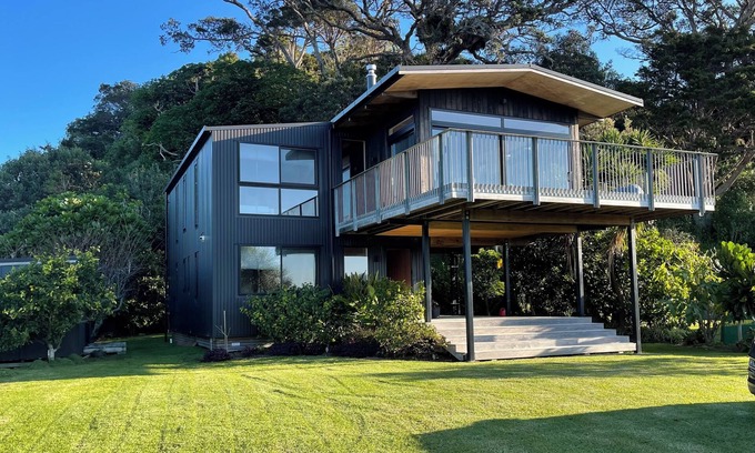 Matapouri House | Peaceful 4-Bedroom Beach House across road from estuary & fantastic beach views