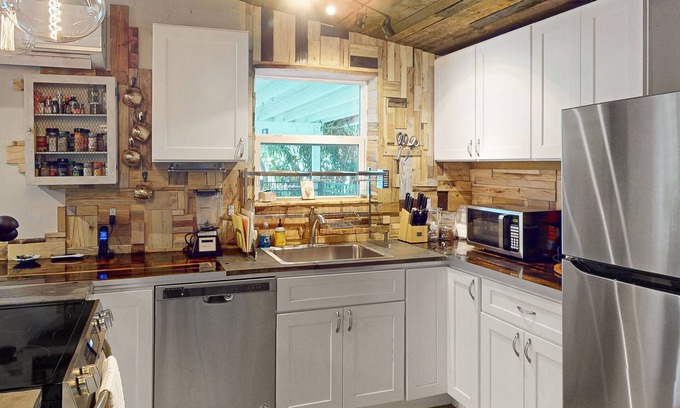 Edgewood House | Peaceful & charming dog-friendly retreat with fire pit, yard, patio, AC, & W/D