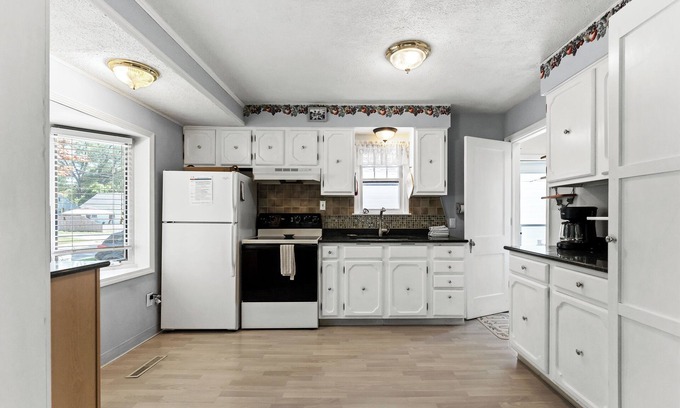 Lakeside House | Peaceful Pastel - Cheerful Cottage Close to Pere Marquette and Muskegon Lake - Pet Friendly