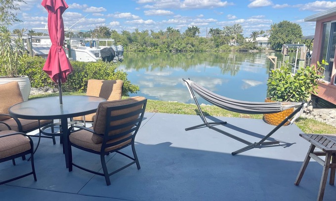 Isles of Capri Apartment | Peaceful Waterfront Efficiency~Dolphins, Manatees and Island Vibes