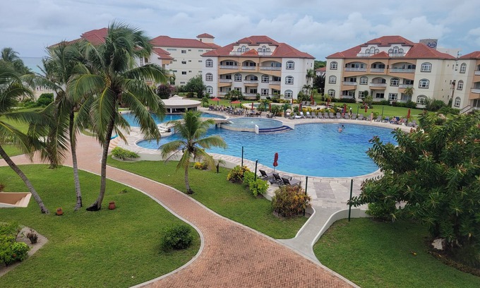 San Pedro Condo | PENTHOUSE CONDO WITH OCEAN AND POOL VIEWS @ GRAND CARIBE RESORT BELIZE