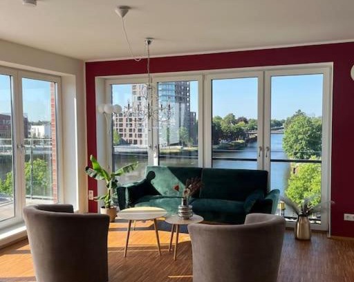 Bahnhofsviertel Apartment | Penthouse-Wohnung mit Flussblick