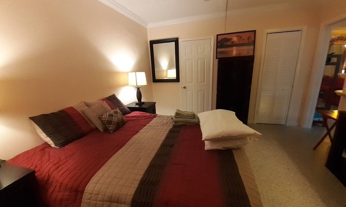 Lake Worth Corridor House | Plumaria Room with private bathroom on shared lakeview House