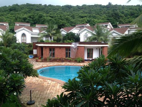 Arpora Apartment | Pool and Garden Facing Apartment in Riviera Foothills Near Baga, Arpora
