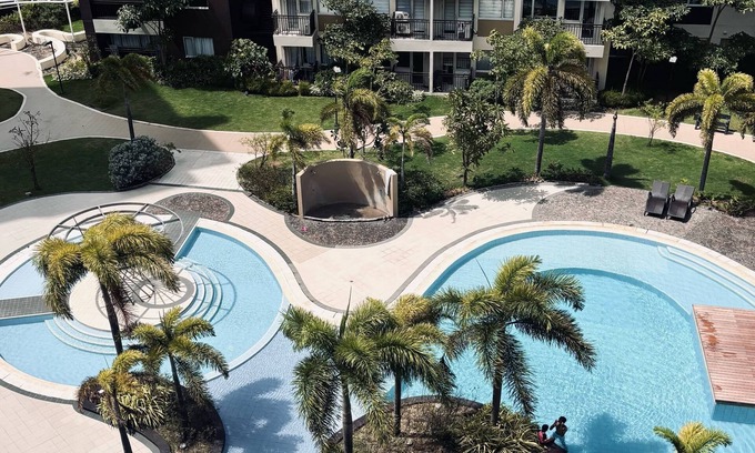 Mandurriao Condo | Pool & Garden Tranquility