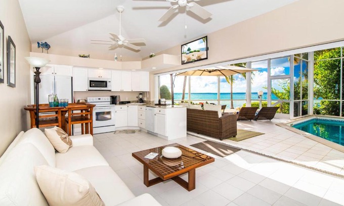 Rum Point Apartment | Pools of the Kai 3 - Waterfront Condo with Private Pool Atrium, Walk to Restaurants