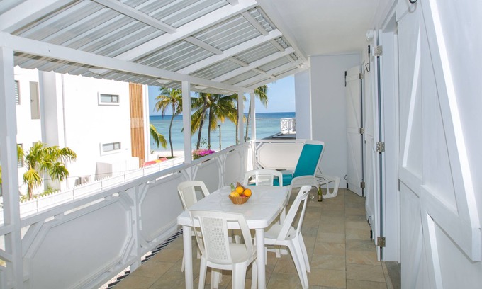 Trou aux Biches House | Porcelaine: Stylish apartment with seaview from its balcony