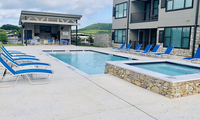 Graford Condo | Possum Kingdom Condo Overlooking Pool, Hot Tub and Marina