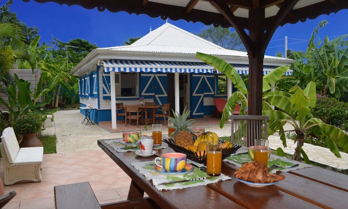 Sainte-Anne Villa | Pretty, old Creole villa with veranda, gazebo and floral garden.