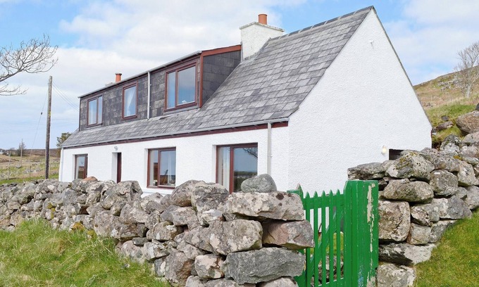 The Hebrides Cottage | Pretty whitewashed croft cottage perched on the hillside above the coastal village of Gairloch .