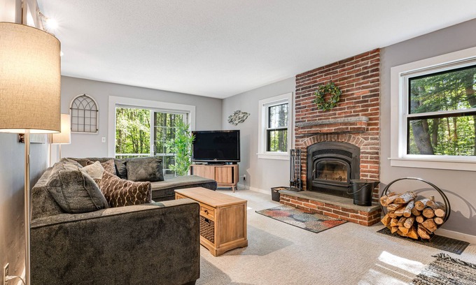 West Hartford House | Quechee Lakes home on three acres - trail access, fireplace, AC - dog-friendly