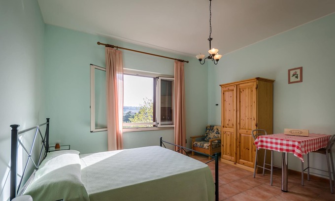 Pineto Apartment | Quiet apartment with swimming pool surrounded by hills 1 km from the sea