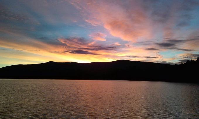 Moultonborough House | Quiet waterfront home on Lees Pond with Ossipee Mountain views.
