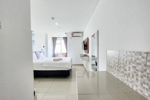 Cikarang Apartment | RedLiving Apartemen Enviro - Aurora Rooms