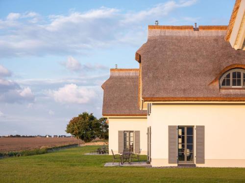 Kreptitz House | Reetland am Meer - Premium Reetdachvilla mit 3 Schlafzimmern, Sauna und Kamin E10