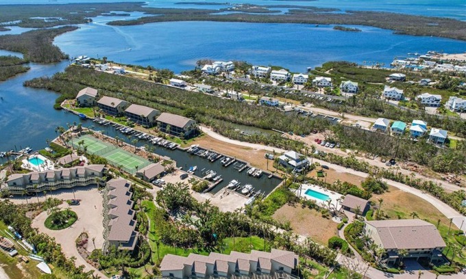 Bokeelia Condo | Relax at Pine Island, 2 bed 2.5 bath. 3 Bikes, 2 Kayaks, 2 heated pools new pier