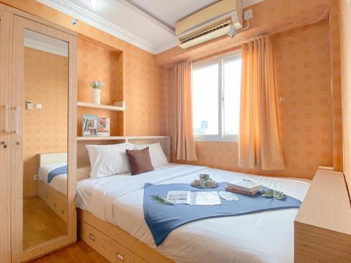 Pekayon Jaya Apartment | Relaxing 2BR with Pool View Mutiara Bekasi Apartment By Travelio