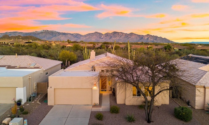 Dove Mountain House | Remodeled modern beauty backs to open desert with mountain views & home theatre