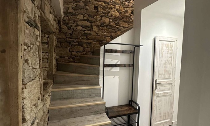 Nexon House | Renovated old house with large living room.