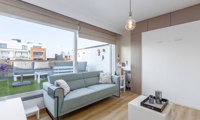 Middelkerke Apartment | Renovated studio with roof terrace near the sea.