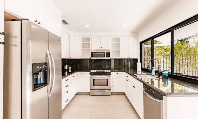 Imperial Point House | Resort Style Backyard - Heated Pool - 2mi to Beach
