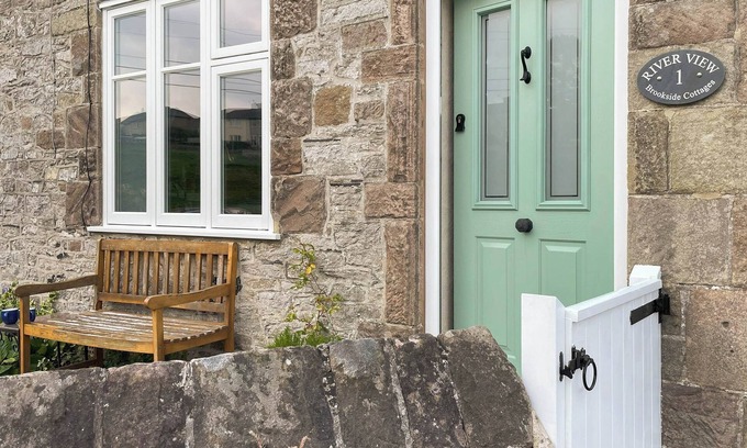Youlgreave Cottage | River View sits beside the River Bradford with views of the hills and river.