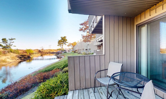 Glen Arbor Condo | Riverfront condo with beach access to lake, fireplace, washer/dryer & cable