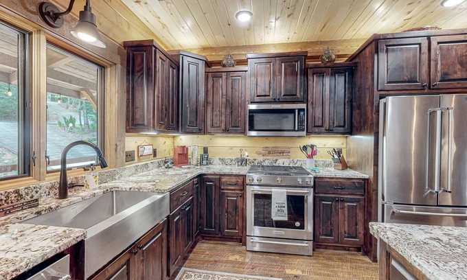 Ellijay House | Riverfront dog-friendly cabin with pool, double-sided fireplace, & firepit
