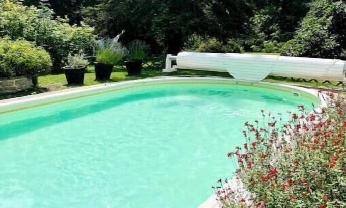 Aulnay-la-Riviere House | Riverfront pool and sauna house in a flower-filled park