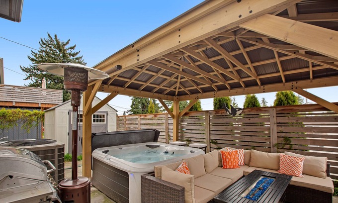 South Delridge House | Roomy, dog-friendly home with private hot tub, fireplaces, decks & living spaces