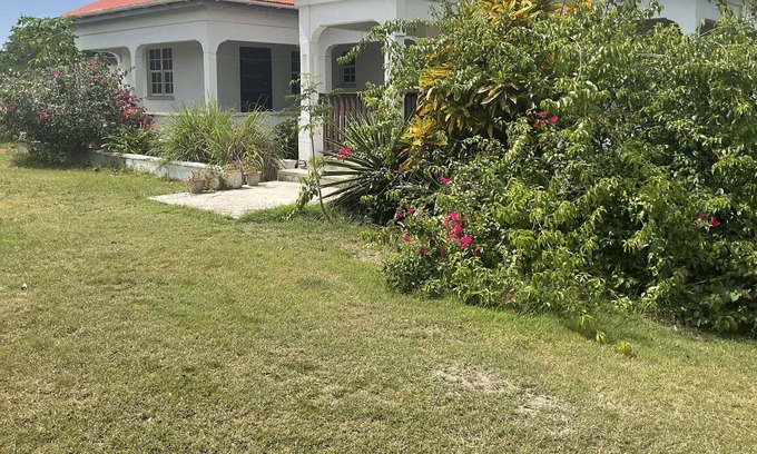All Saints Villa | Rustic house on lush large land of fruit trees. 15 mins English Harbor