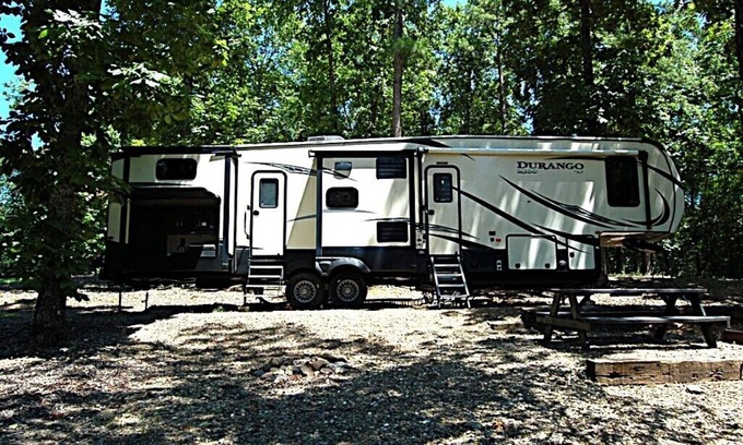 Broken Bow House | RV among the trees in Broken Bow. Dog friendly, WiFi, 2 bedroom, fireplace.