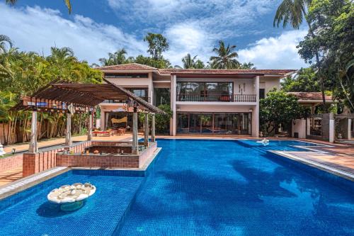 Alibaug Villa | Saffronstays Casa Del Palms, Alibaug - luxury pool villa with chic interiors, alfresco dining and island bar