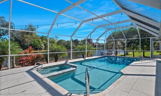 Palm Harbor House | SALTY TURTLE Luxury Salt Water Pool Home on Salt Water Canal with Tiki Bar