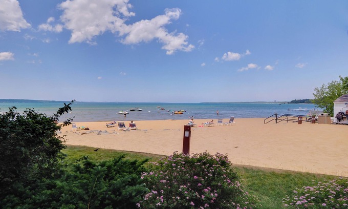 Traverse City Condo | Sandy Beachfront | Condo #107 | Sleeps 6 Guests