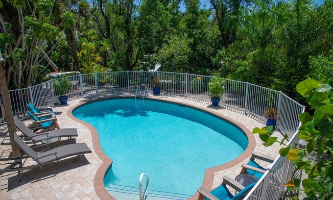 Shell Harbor House | "Sanibel Oasis", Private Home with heated pool on a canal