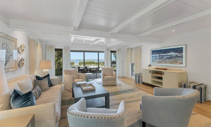 Cherokee Park House | Sarasota Renovated Waterfront Home with Dock Wide Open Bay Views Heated Pool