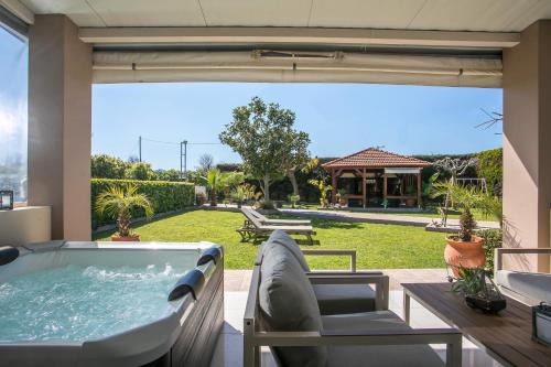 Petaloudes House | Sea Breeze & Nature villa ,near the sea, luxury jagguzi and spa private garden