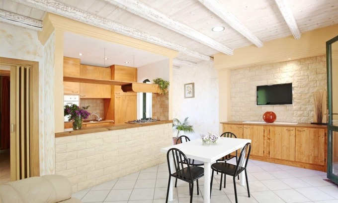 Chia Villa | Seaside villa with garden and panoramic mountain views.