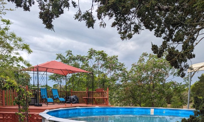 Cedar Creek House | Secluded Country Home on 15 Acres. Pool, BBQ, Hot Tub and Ping Pong. Close to COTA. RV Parking