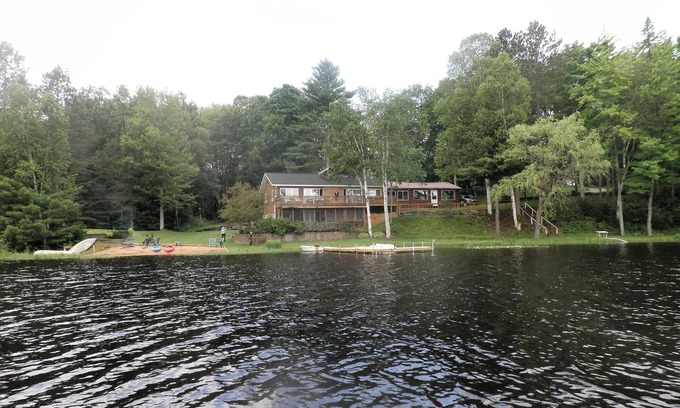 Rapid River Cabin | SECLUDED LODGE WITH ONE OF THE LARGEST PRIVATE STOCKED LAKES IN MICHIGAN.