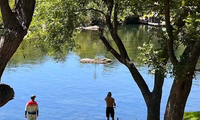 Burnet House | Shaded riverfront getaway. Dog friendly