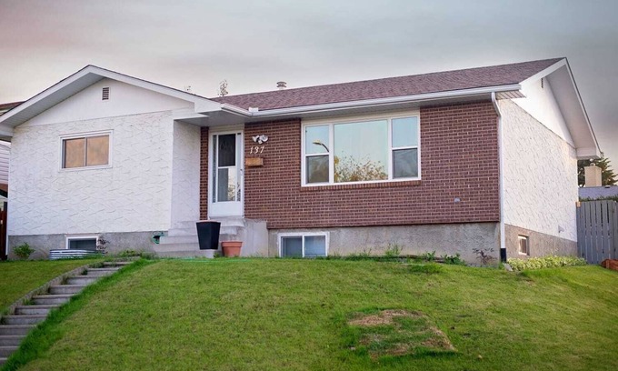 Calgary House | Simply beautiful and comfortable main suite with a view.