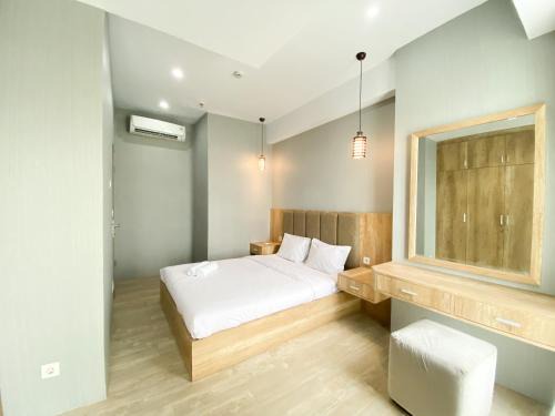 Cikarang Apartment | Simply Look and Comfort 1BR Vasanta Innopark Apartment By Travelio